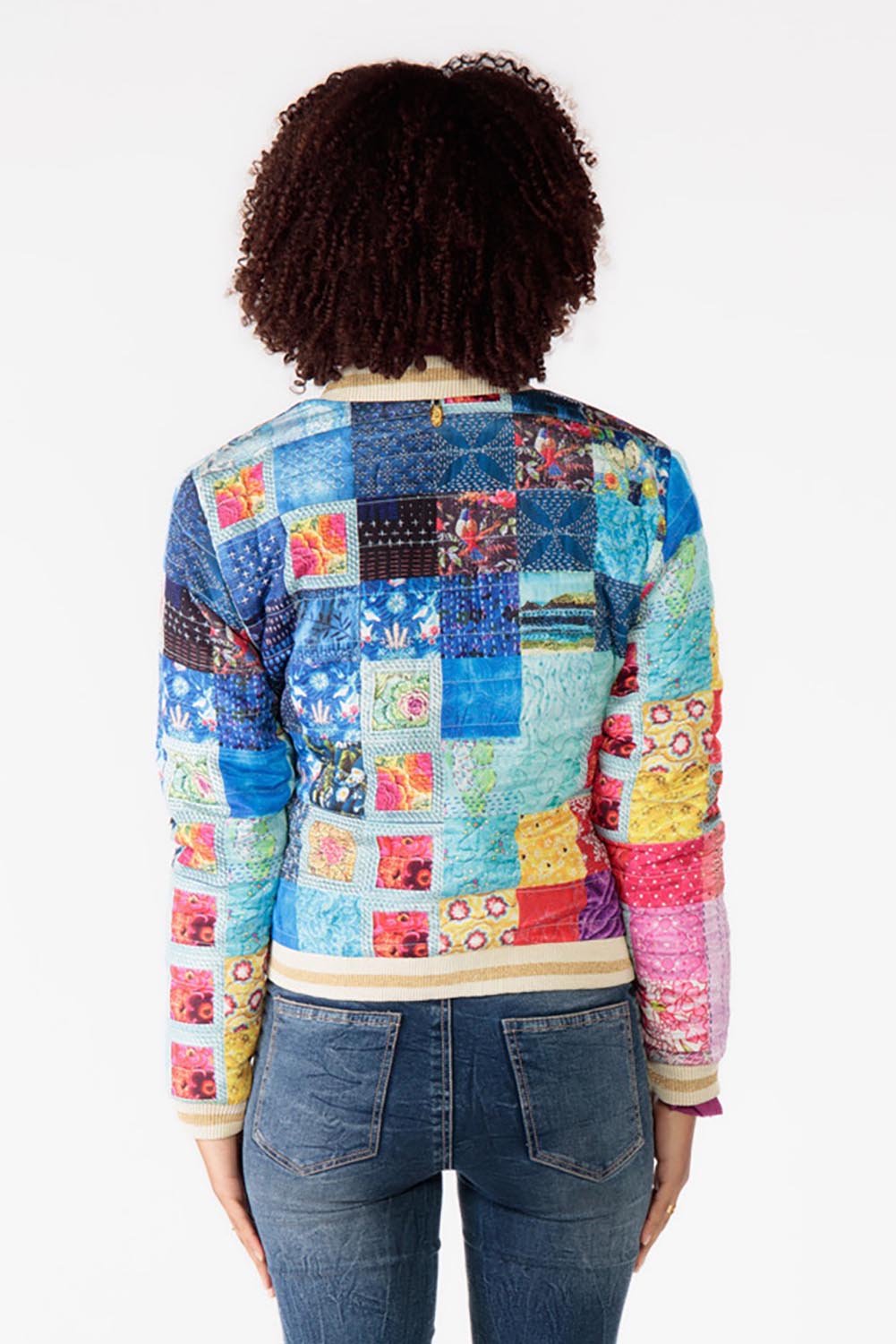 A model wearing the Oklahoma Quilted Jacket in colour Multi (Blue), from the back