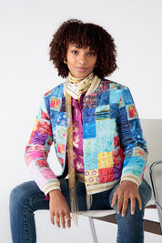 A model wearing the Oklahoma Quilted Jacket in colour Multi (Blue), from the front, cropped image