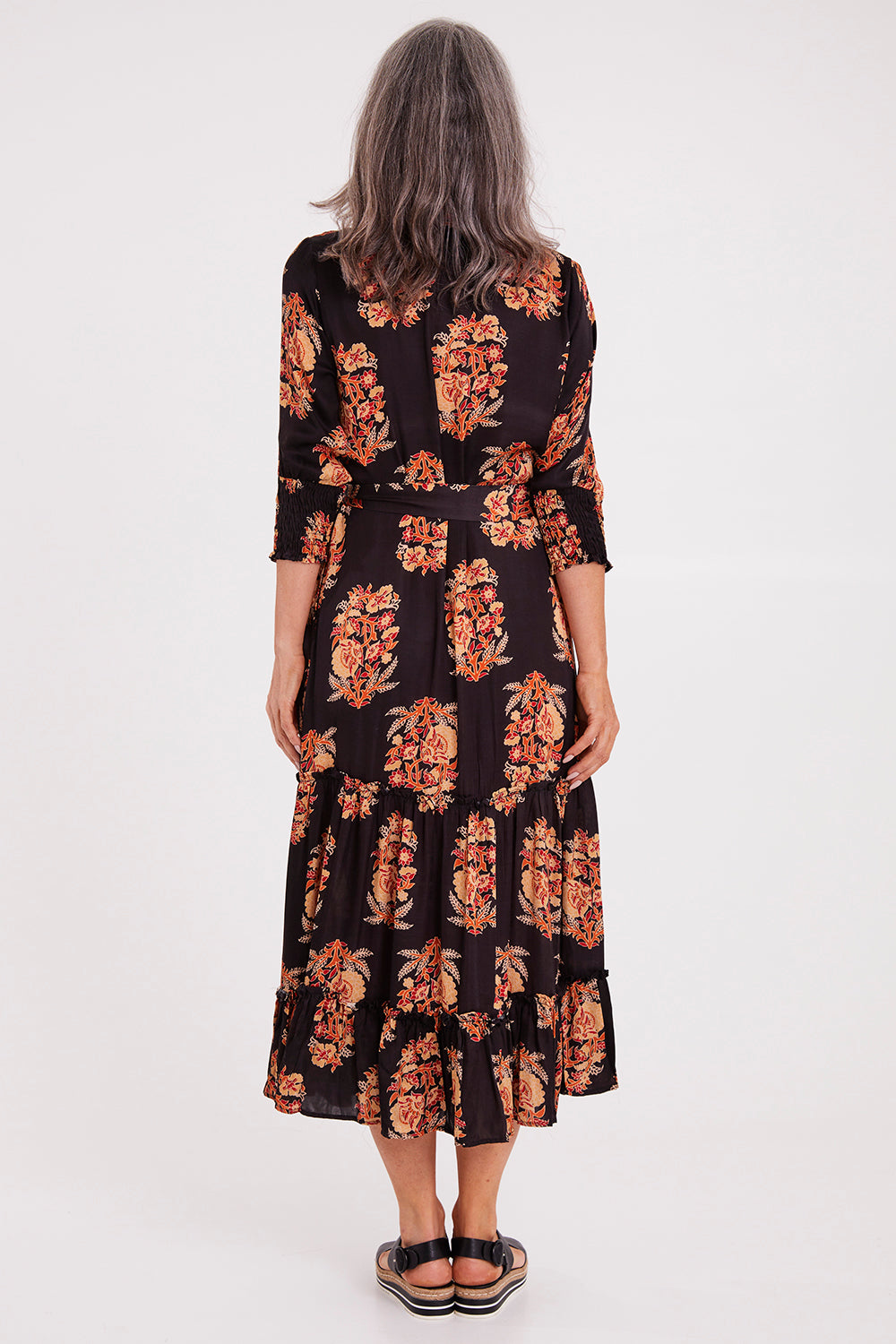 Model Luisa wearing size S of the Paisley Dress in colour Black (Black), from the back