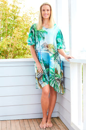 Model Maddy wearing size S of the Palm Dress in colour Palm (Blue), from the front, showing the whole outfit