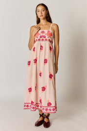 Model Genericm wearing size sample of the Palmy Sundress – Pink in colour Pink, from the front