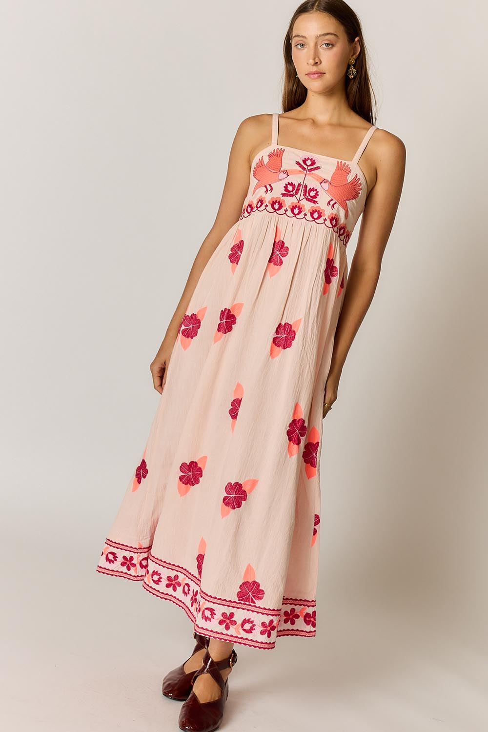 Model Genericm wearing size sample of the Palmy Sundress – Pink in colour Pink, from the front