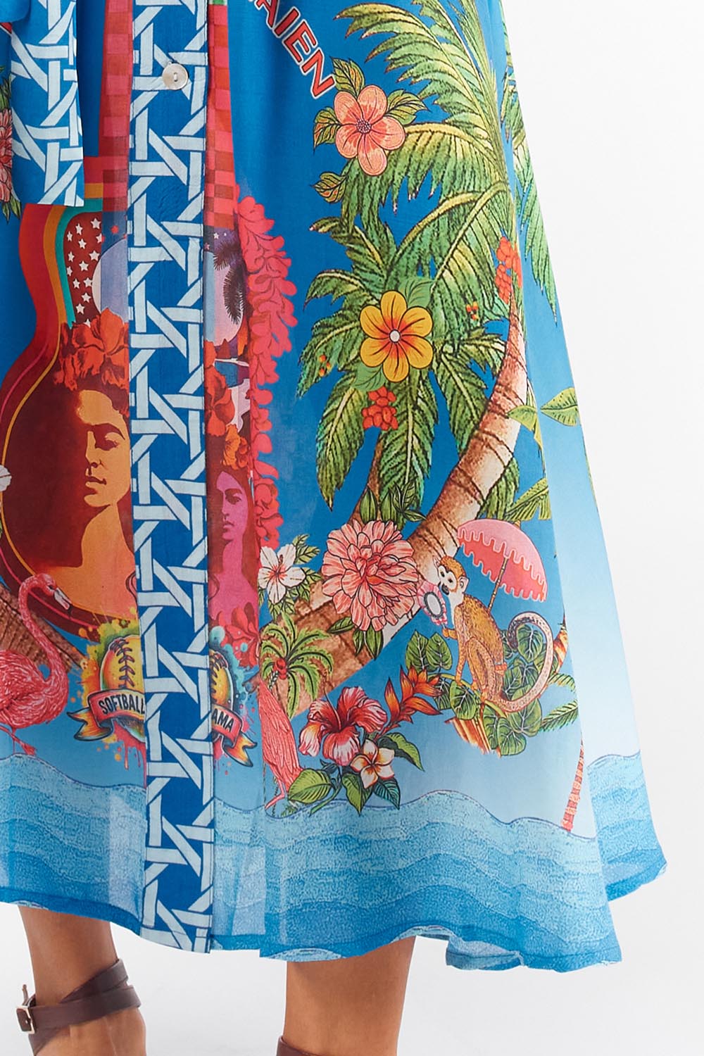 A model wearing the Paradis Maxi Dress in colour Blue (Blue), from the front, cropped image