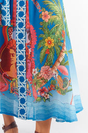 A model wearing the Paradis Maxi Dress in colour Blue (Blue), from the front, cropped image