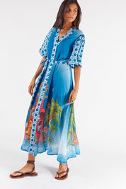 A model wearing the Paradis Maxi Dress in colour Blue (Blue), from the front, showing the whole outfit