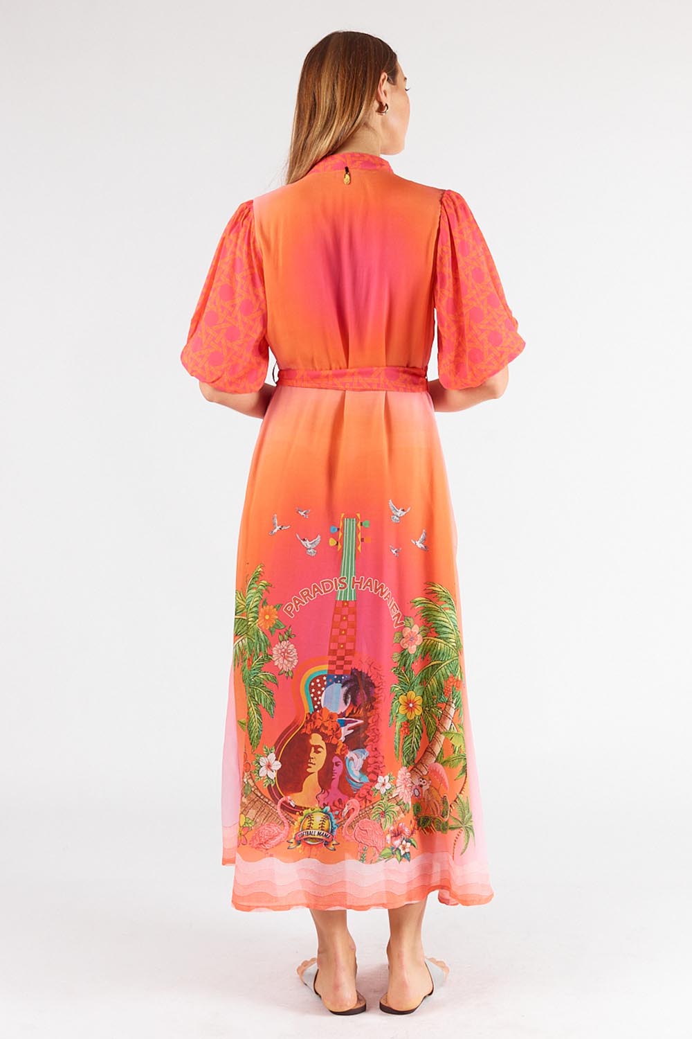 A model wearing the Paradis Maxi Dress in colour Pink (Pink), from the back