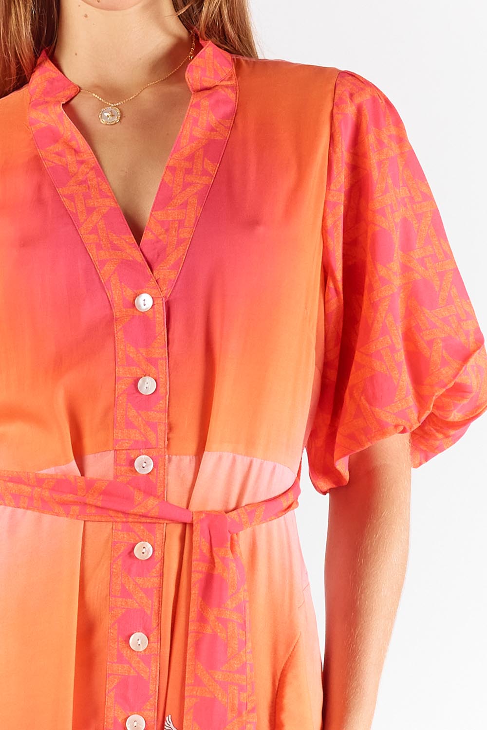 A model wearing the Paradis Maxi Dress in colour Pink (Pink), from the front, cropped image