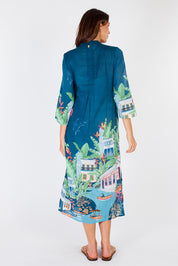 A model wearing the Paraty Cotton Kaftan Dress in colour Multi (Blue), from the back