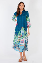 A model wearing the Paraty Cotton Kaftan Dress in colour Multi (Blue), from the front, showing the whole outfit