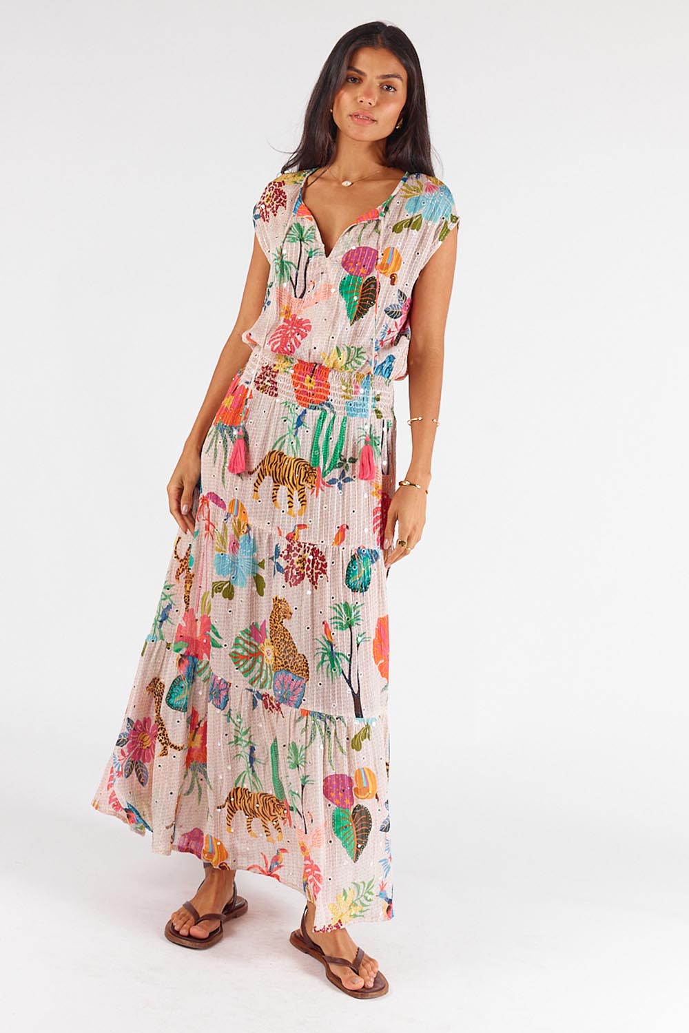 A model wearing the Pretoria Maxi Dress in colour Cream, from the front, showing the whole outfit