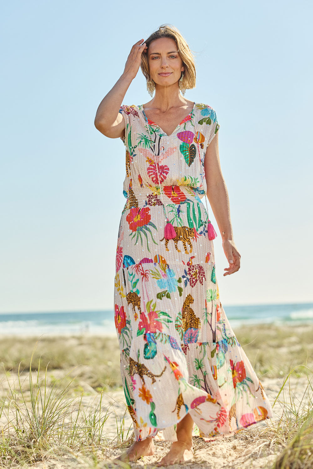 Model Riina wearing size S of the Pretoria Maxi Dress in colour Cream, from the front, showing the whole outfit