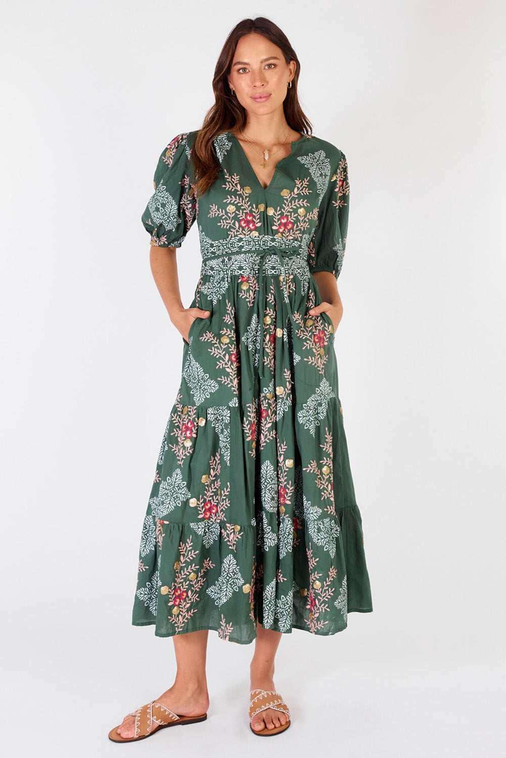 A model wearing the Primavera Cotton Maxi Dress in colour Olive (Green), from the front, showing the whole outfit