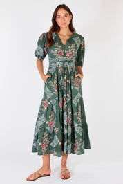 A model wearing the Primavera Cotton Maxi Dress in colour Olive (Green), from the front, showing the whole outfit