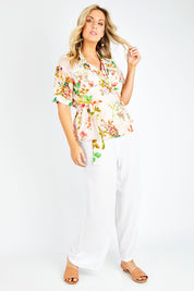 Model Jess wearing size L of the Priscilla Top in colour Pink (Pink), from the front, showing the whole outfit