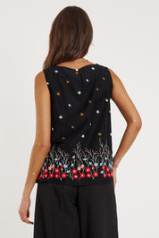 A model wearing the Provence Cotton Tank Top in colour Black (Black), from the back