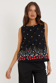 A model wearing the Provence Cotton Tank Top in colour Black (Black), from the front, cropped image
