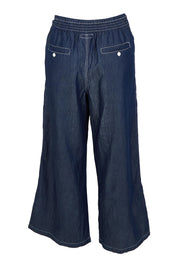 Product shot of the Pula Pant in colour Denim (Blue), from the back