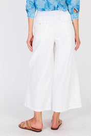 A model wearing the Pula Pant in colour White (White), from the back