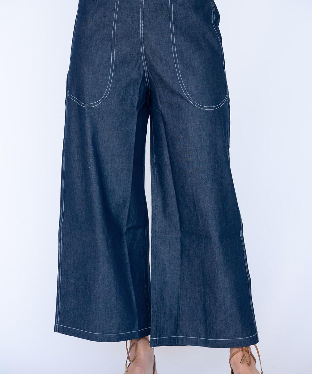 Model Genericm wearing size sample of the Pula Pant – Denim in colour Denim, from the front