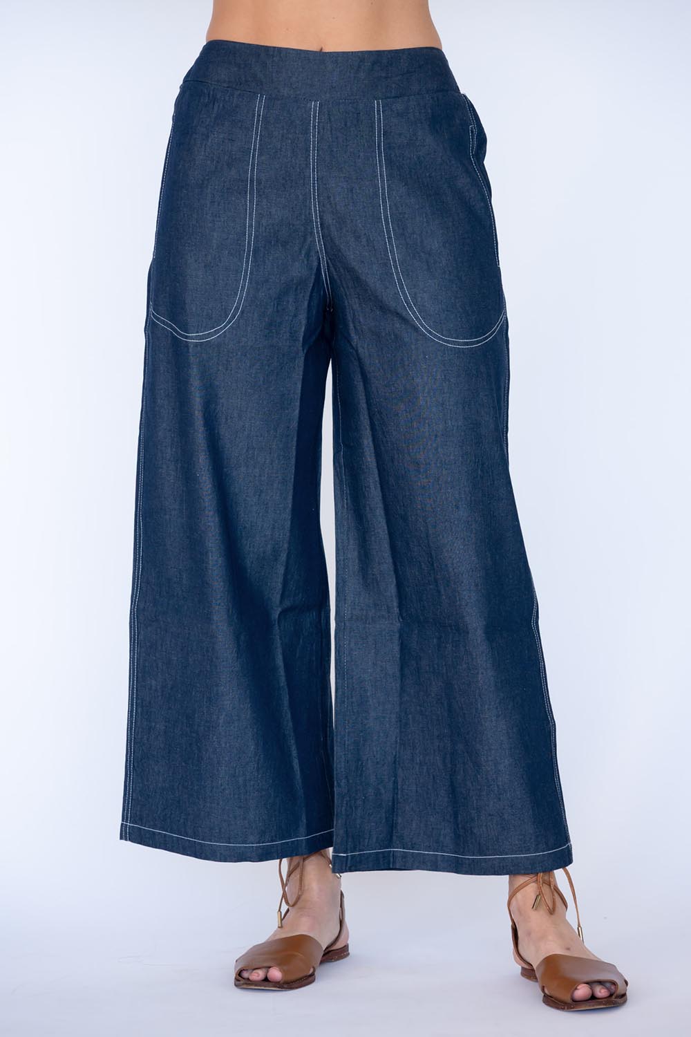 Model Genericm wearing size sample of the Pula Pant – Denim in colour Denim, from the front