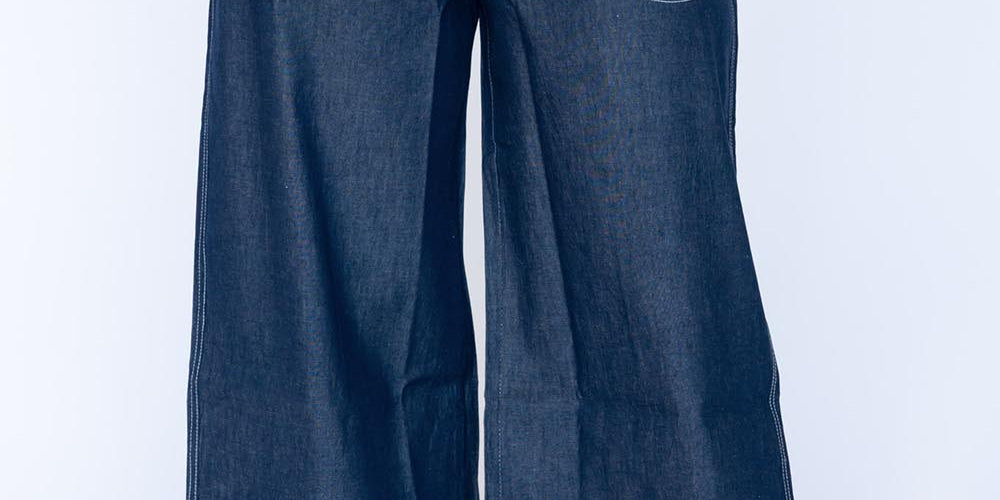Model Genericm wearing size sample of the Pula Pant – Denim in colour Denim, from the front