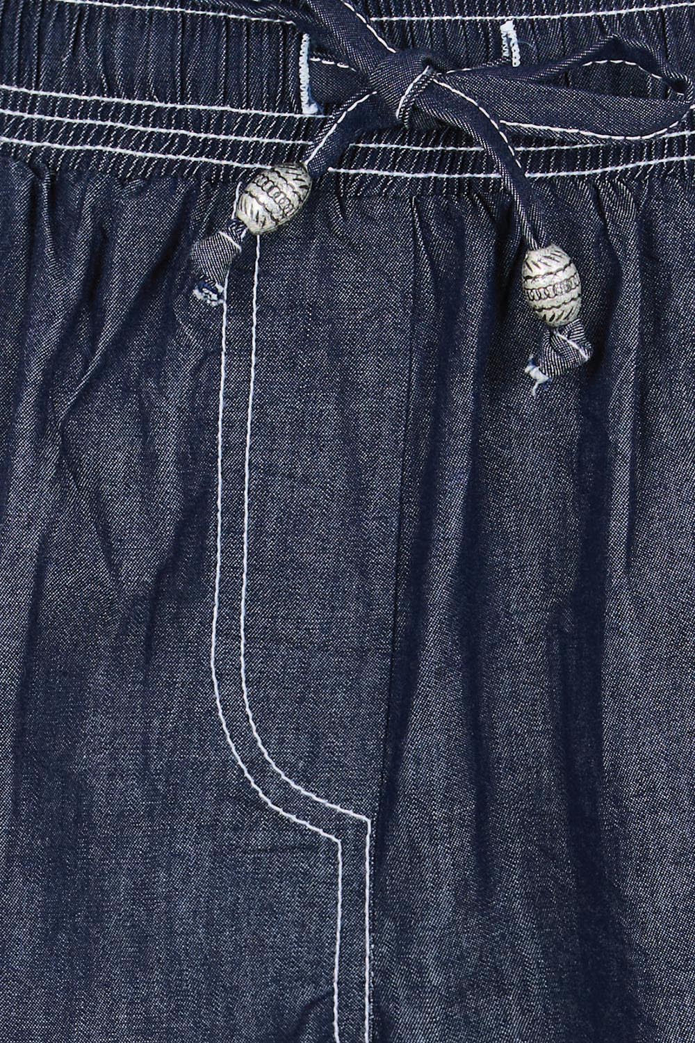 Product shot of the Pula Short – Denim in colour Denim, showing detail