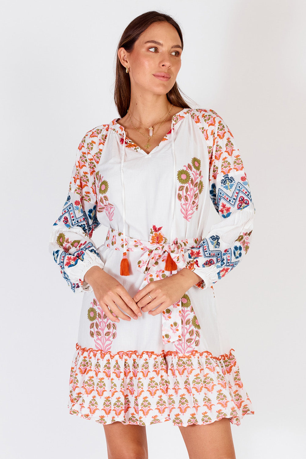 A model wearing the Rampur Cotton Dress in colour Red (White), from the front, cropped image