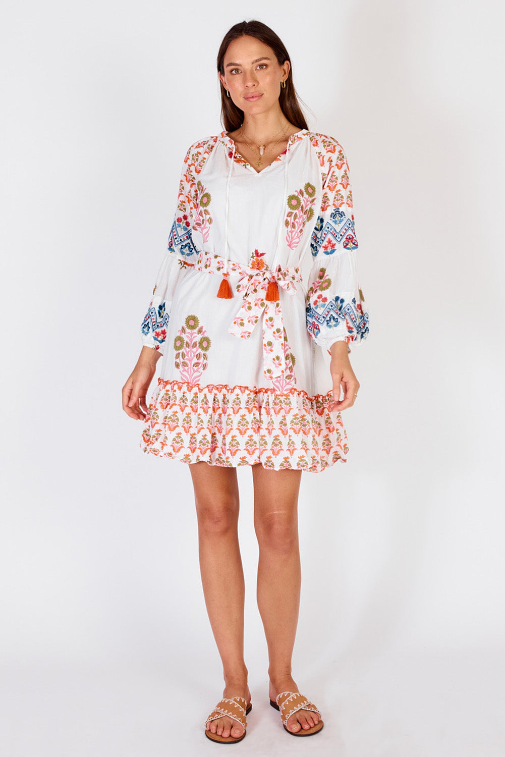A model wearing the Rampur Cotton Dress in colour Red (White), from the front, showing the whole outfit