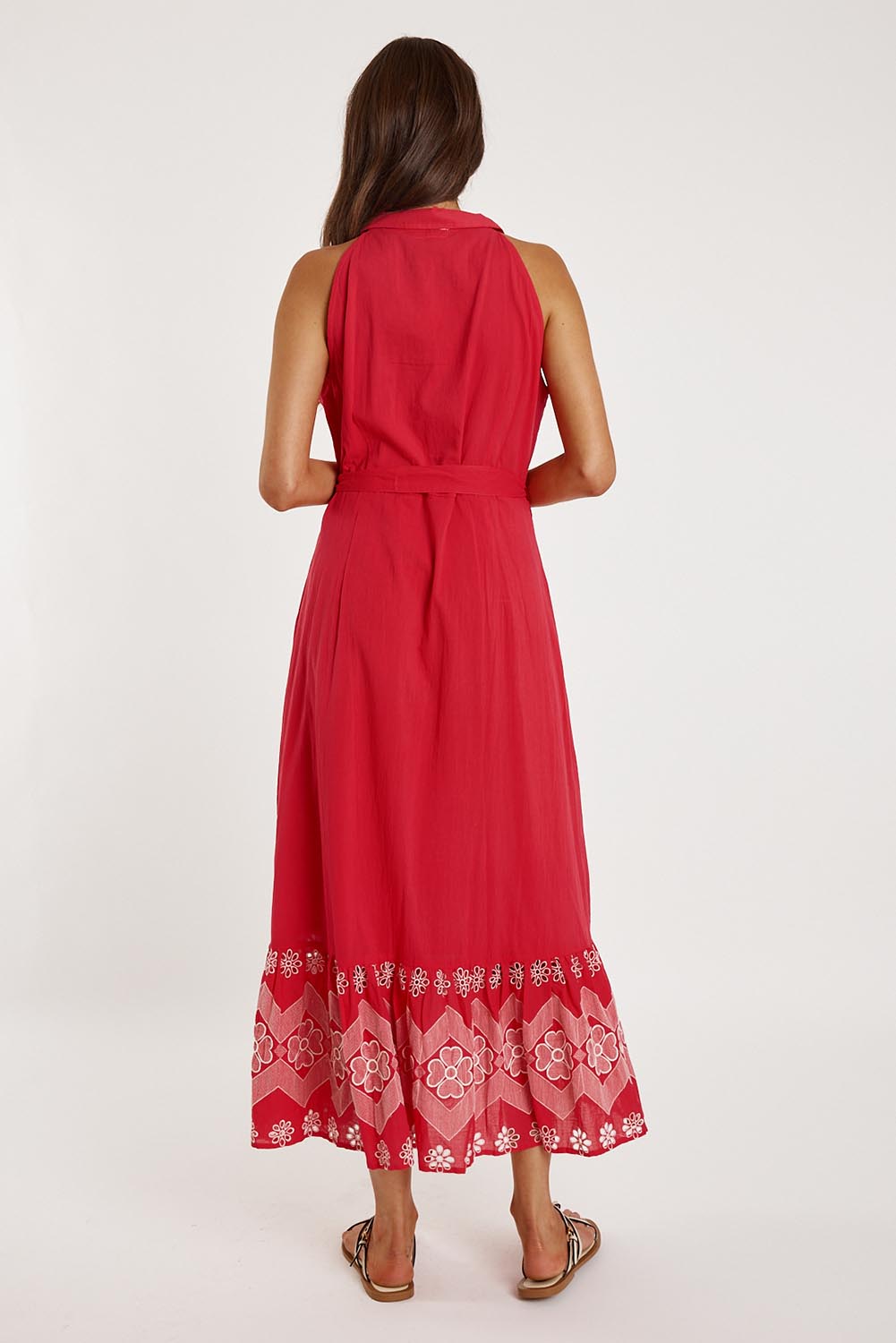 A model wearing the Ravello Cotton Maxi Dress in colour Watermelon (Red), from the back