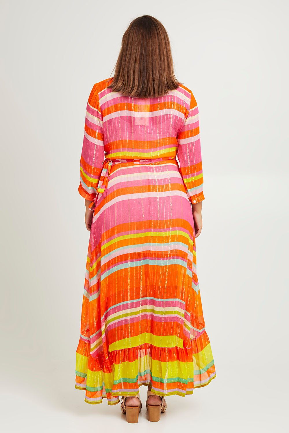 Model Monique wearing size L of the Riviera Wrap Dress in colour Red (Pink), from the back