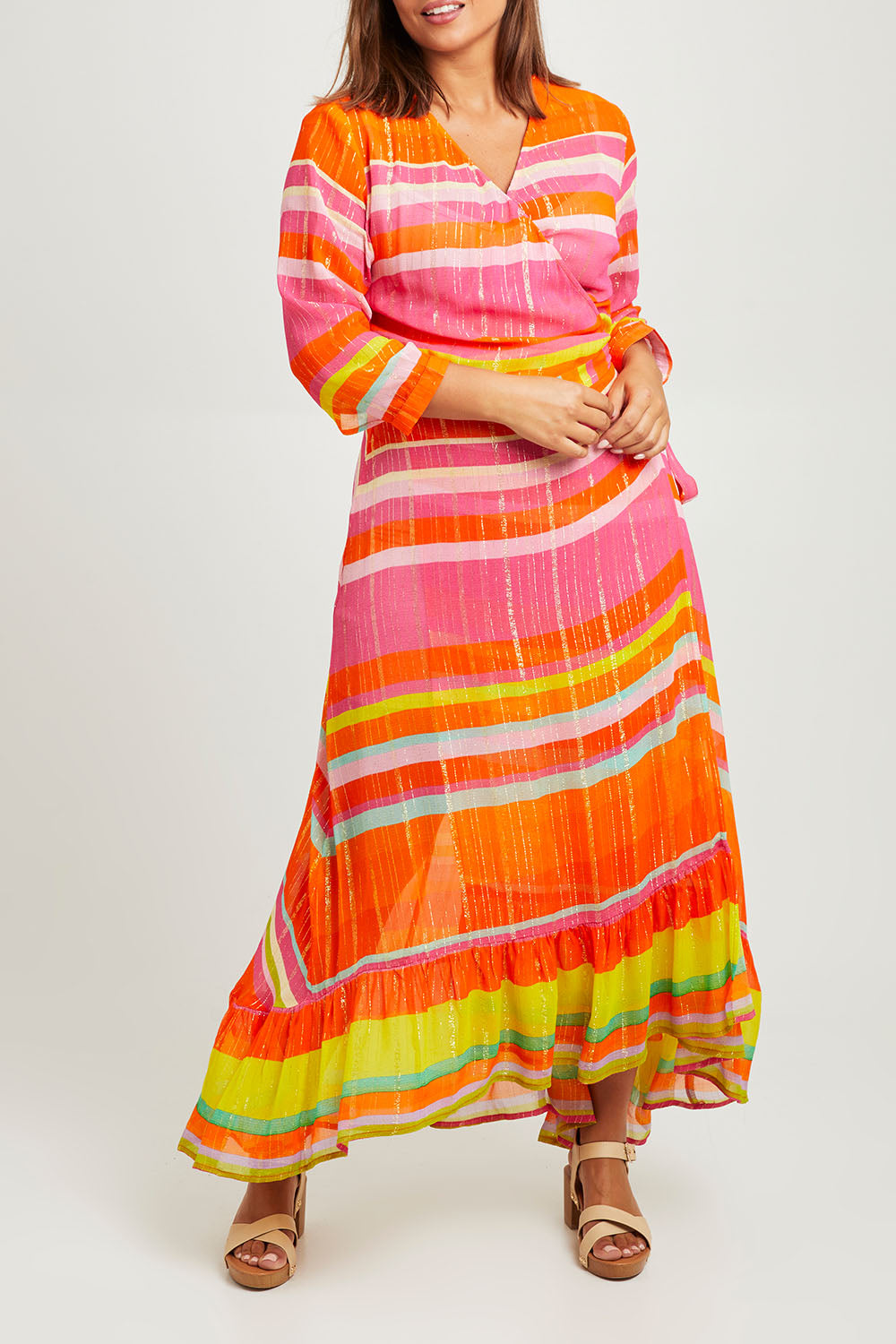 Model Monique wearing size L of the Riviera Wrap Dress in colour Red (Pink), from the front, cropped image