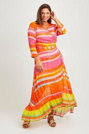 Model Monique wearing size L of the Riviera Wrap Dress in colour Red (Pink), from the front, showing the whole outfit