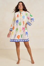 Model Tahnee wearing size S of the Rock Lobster Cotton Dress in colour Print (White), from the front, showing the whole outfit
