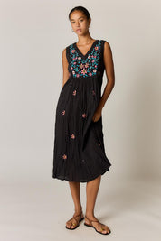 Model Genericm wearing size sample of the Sasha Sundress – Black in colour Black, from the front