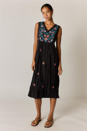 Model Genericm wearing size sample of the Sasha Sundress – Black in colour Black, from the front