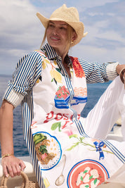 Model Genericm wearing size sample of the Sicily Cotton Dress – Print in colour Print, in a cropped view