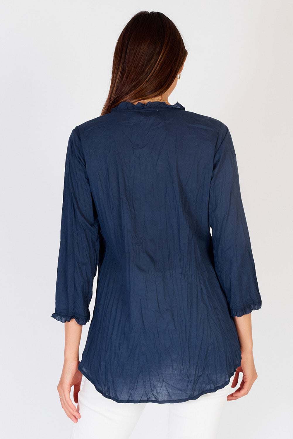 A model wearing the Sunrise Cotton Shirt in colour Navy (Blue), from the back