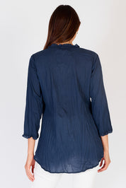 A model wearing the Sunrise Cotton Shirt in colour Navy (Blue), from the back