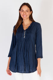 A model wearing the Sunrise Cotton Shirt in colour Navy (Blue), from the front, cropped image
