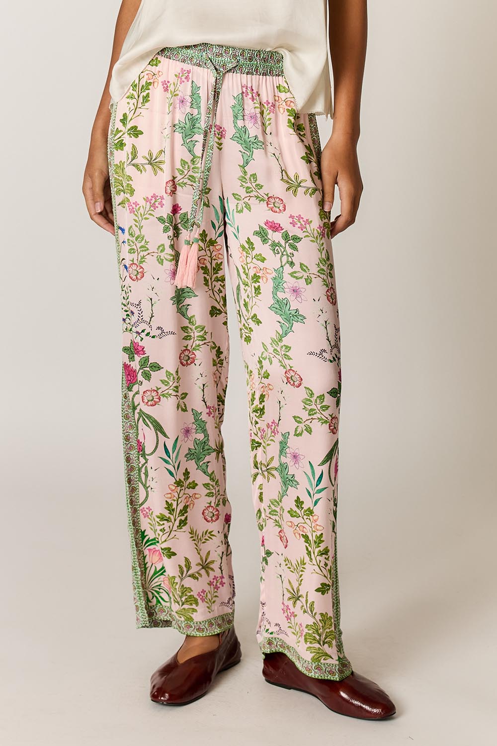Model Genericm wearing size sample of the Tatiana Pant – Pink in colour Pink, in a cropped view