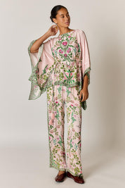 Model Genericm wearing size sample of the Tatiana Poncho – Pink in colour Pink, from the front