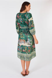 A model wearing the Le Tigre Dress in colour Greenmulti (Green), from the back