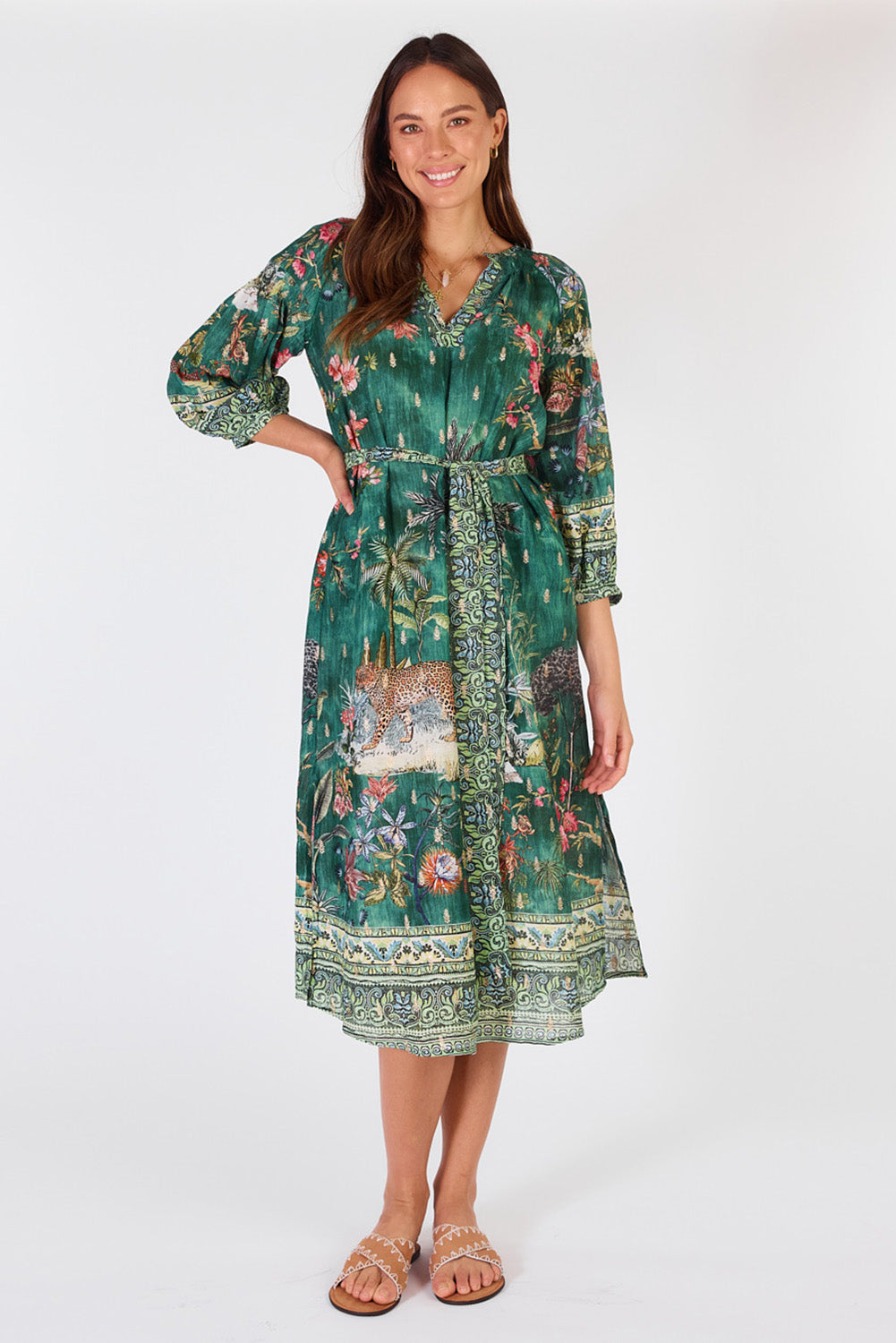 A model wearing the Le Tigre Dress in colour Greenmulti (Green), from the front, showing the whole outfit