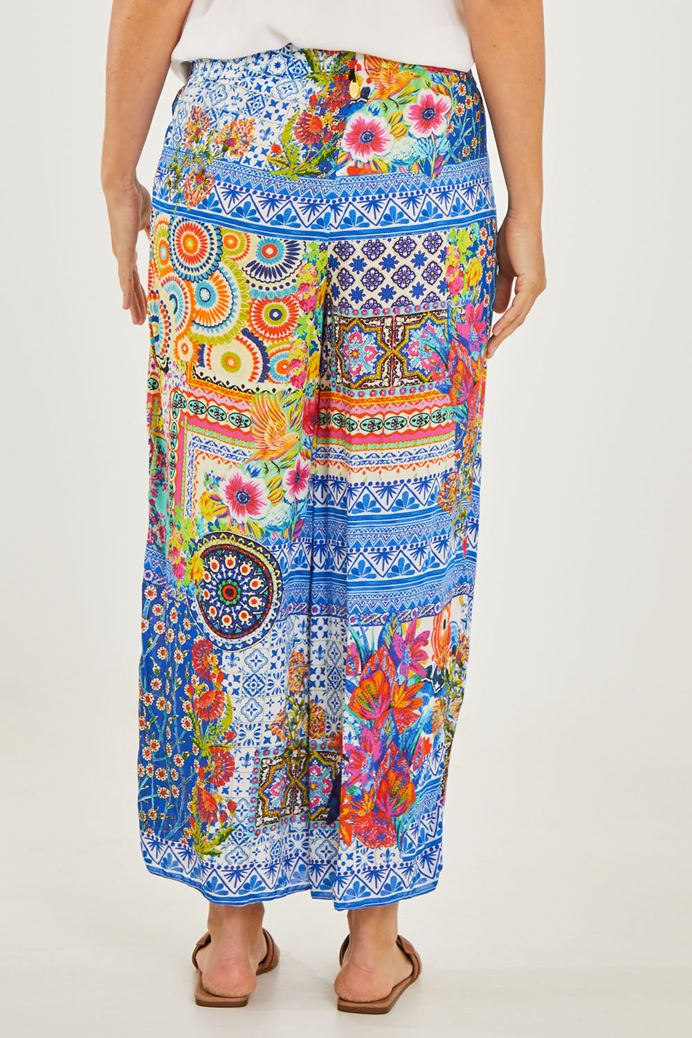 Model Georgia wearing size S of the Toucan Pant in colour Print (Blue), from the back