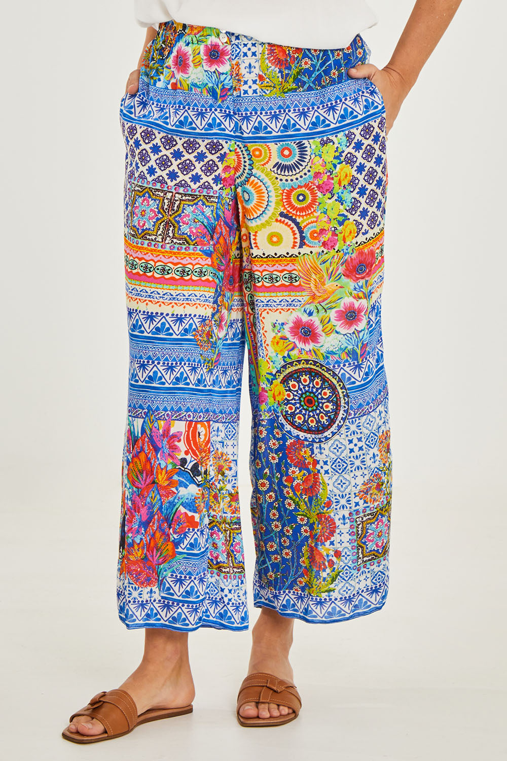 Model Georgia wearing size S of the Toucan Pant in colour Print (Blue), from the front, cropped image