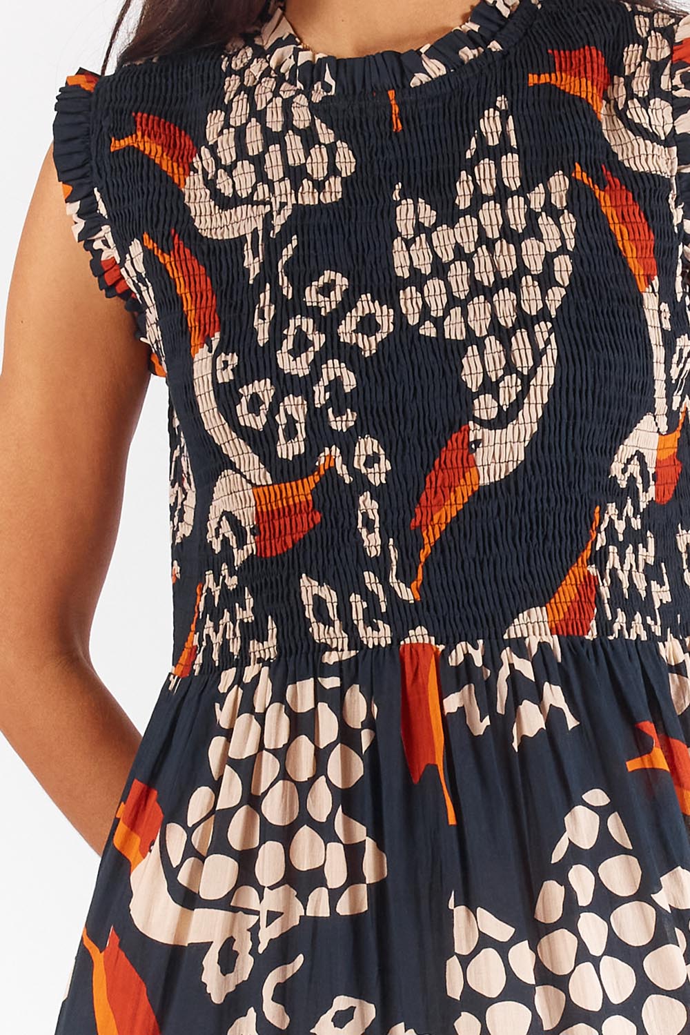 A model wearing the Toucan Cotton Maxi Dress in colour Multi (Black), from the front, cropped image