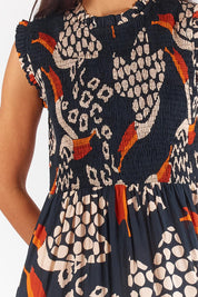 A model wearing the Toucan Cotton Maxi Dress in colour Multi (Black), from the front, cropped image