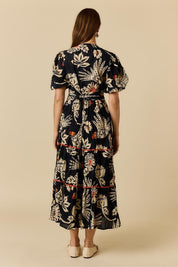 Model Genericm wearing size sample of the Tucan Maxi Dress – Black in colour Black, from the front