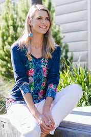 Model Kelly wearing size S of the Valeria Long Tee in colour Navy (Blue), from the front, showing the whole outfit