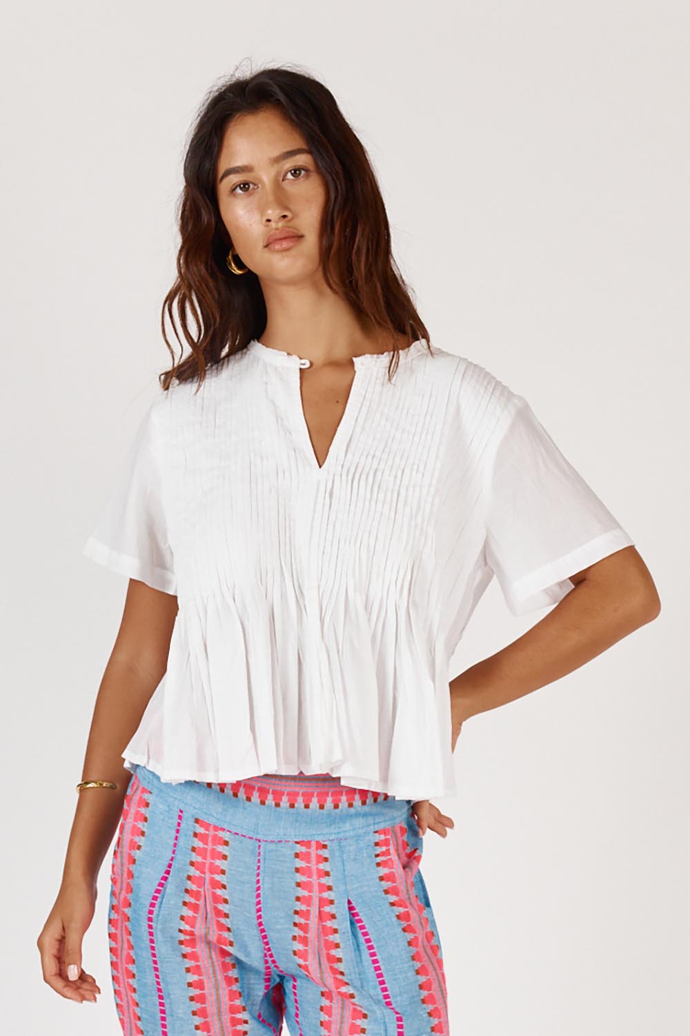 A model wearing the Vivian Cotton Top in colour White (White), from the front, cropped image